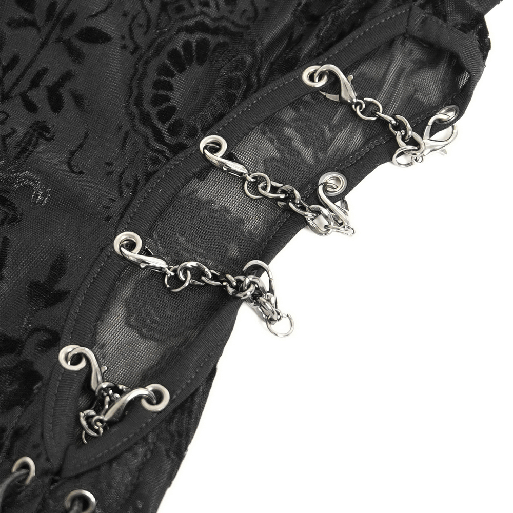 Close-up of gothic sheer black dress featuring chain shoulder detail and intricate floral embroidery.