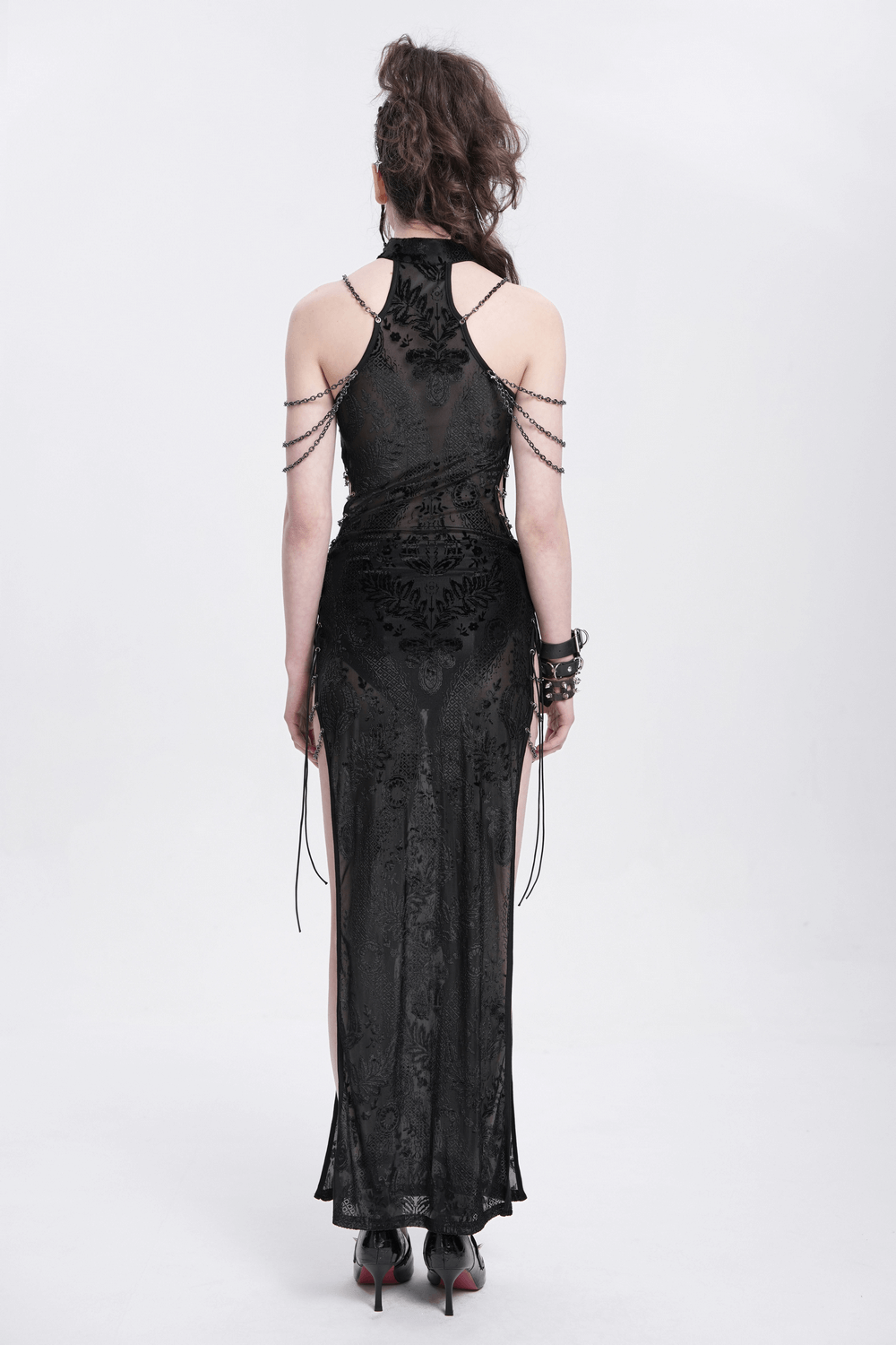 Back view of a gothic sheer black dress with chain shoulder details and floral embroidery, perfect for alternative fashion.