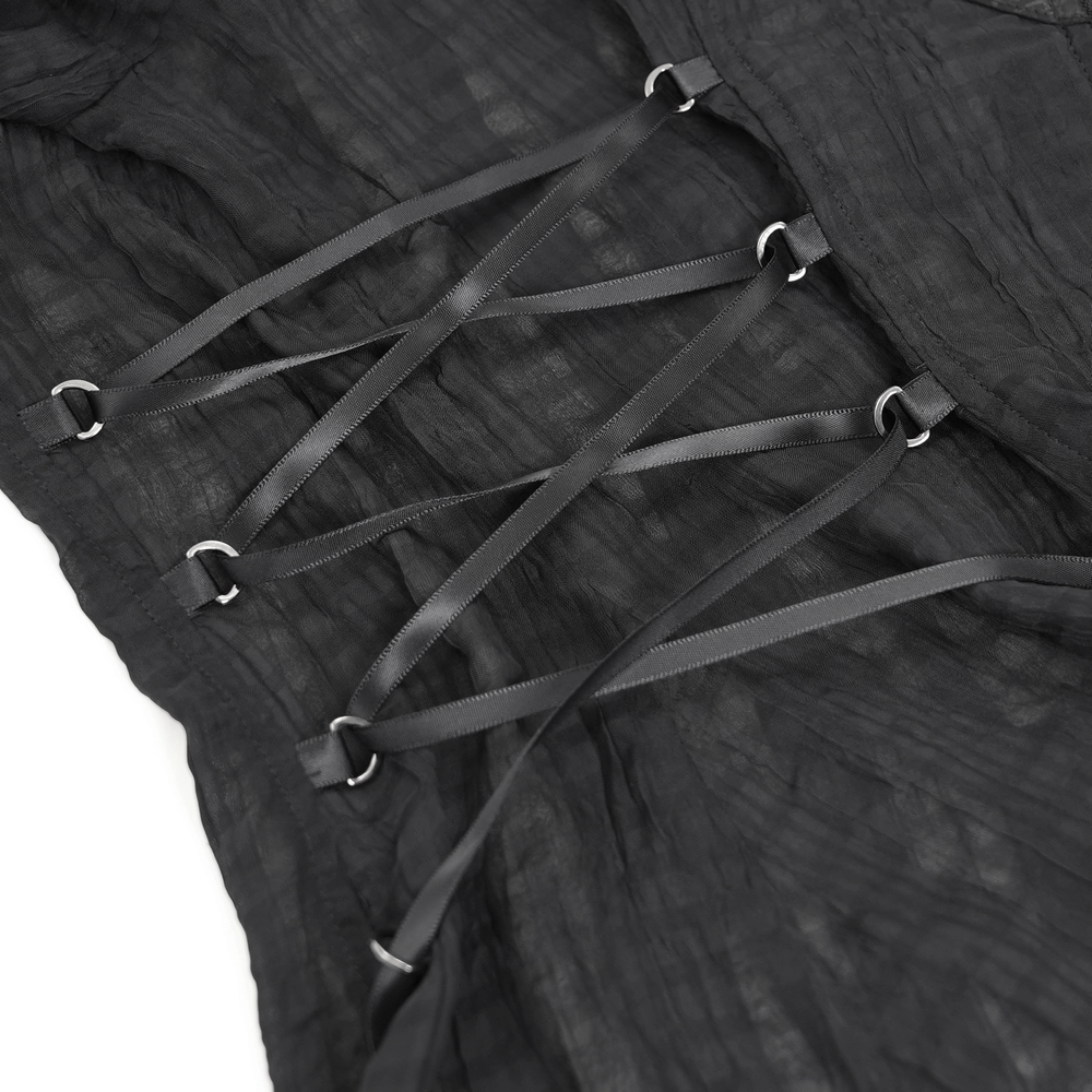 Close-up of lace-up design on sheer black gothic blouse, showcasing edgy ribbon lacing and textured fabric.