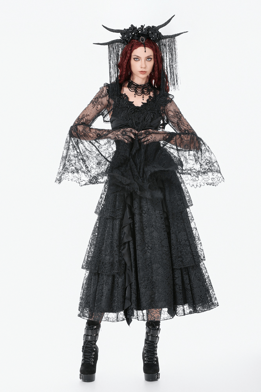 Gothic Sheer Lace Shrug with Dramatic Long Sleeves paired with a layered black lace dress and striking accessories.