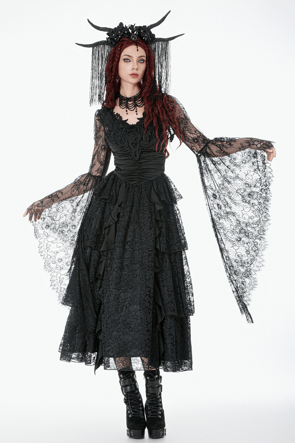 Gothic Sheer Lace Shrug with Dramatic Long Sleeves worn over a black lace dress featuring intricate embroidery and flared sleeves.