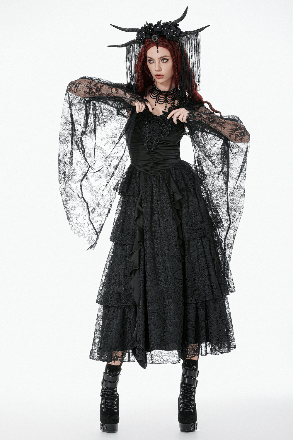 Gothic Sheer Lace Shrug with Dramatic Long Sleeves worn over a gothic black dress showcasing intricate lace and dramatic detailing.