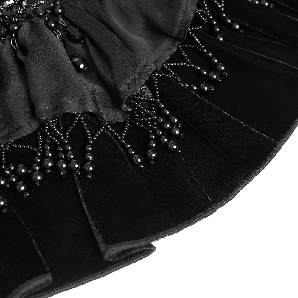 Close-up of gothic sheer mesh shrug with black beads, intricate ruffles, and feather detailing for an elegant touch.