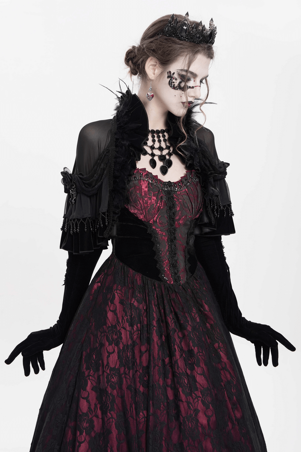 Gothic sheer mesh shrug with ruffles and feather trim over a Victorian-inspired dress, perfect for cosplay and alternative fashion.