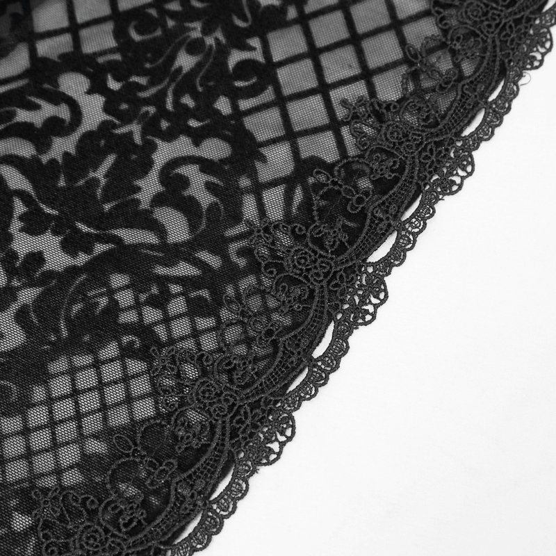 Close-up of black floral mesh fabric with intricate lace trim, perfect for a gothic elegant cape.