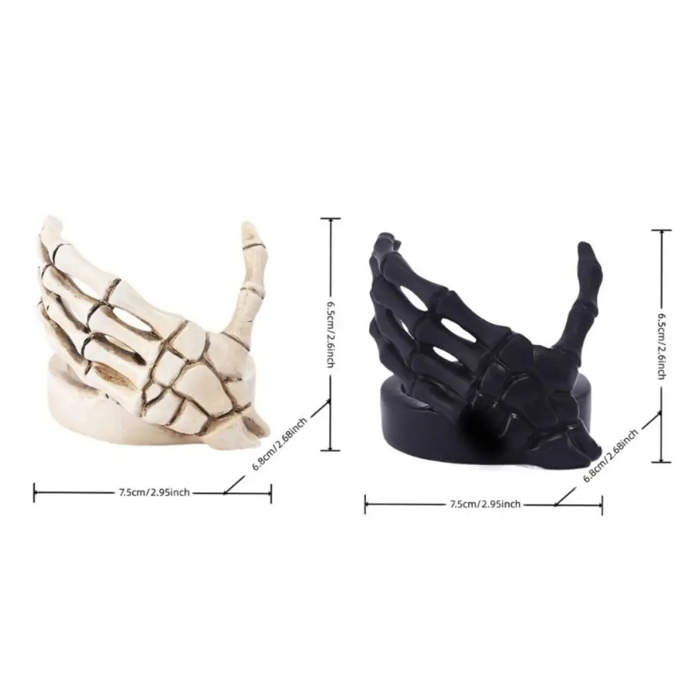Gothic Skeletal Hand Candle Holder for Dark Decor in black and antique bone colors for Halloween and moody home styling.