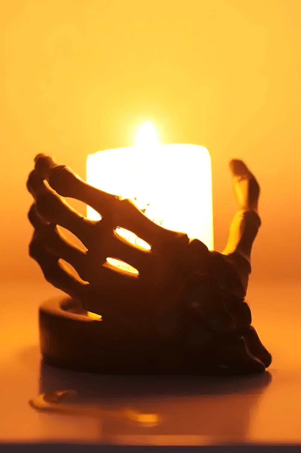 Gothic Skeletal Hand Candle Holder for Dark Decor illuminating a cozy space with an eerie glow.