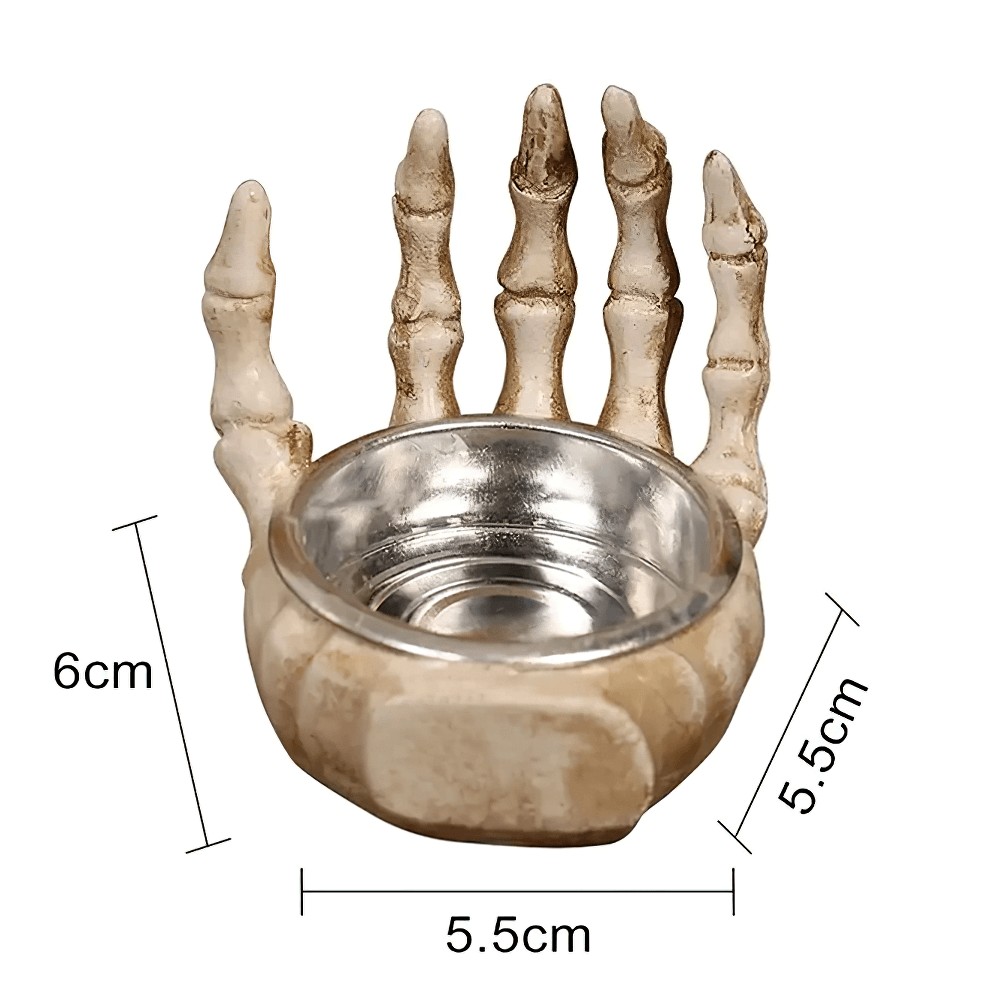 Gothic skeleton hand candle holder in resin, perfect for Halloween decor and spooky gifts.