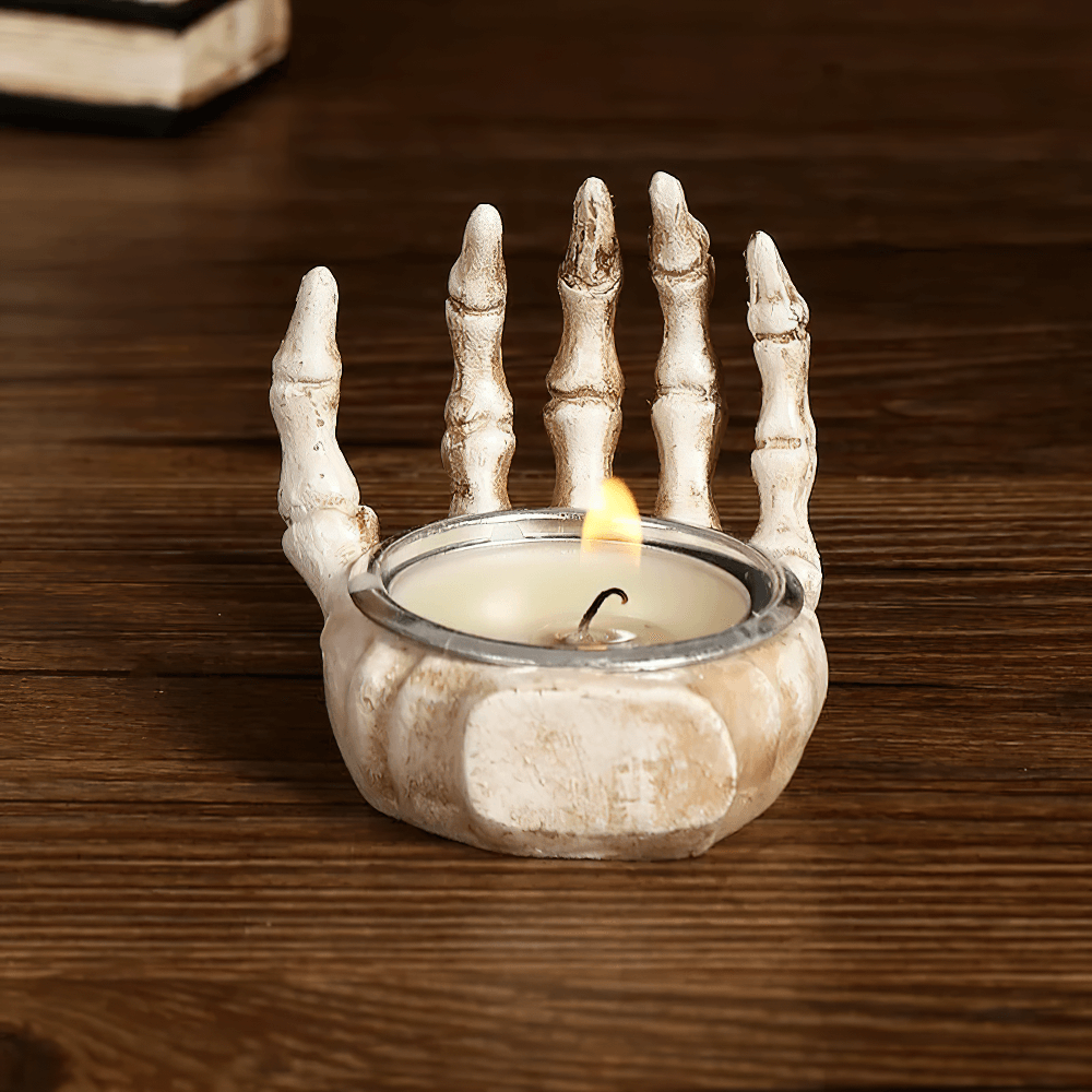 Gothic skeleton hand candle holder with tea light, perfect for Halloween decor and spooky gifts.