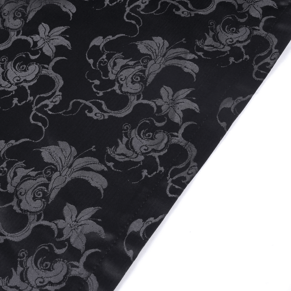 Intricate floral embroidery on a flowing black gothic skirt with silver details and embellishments. Perfect for gothic glamour.