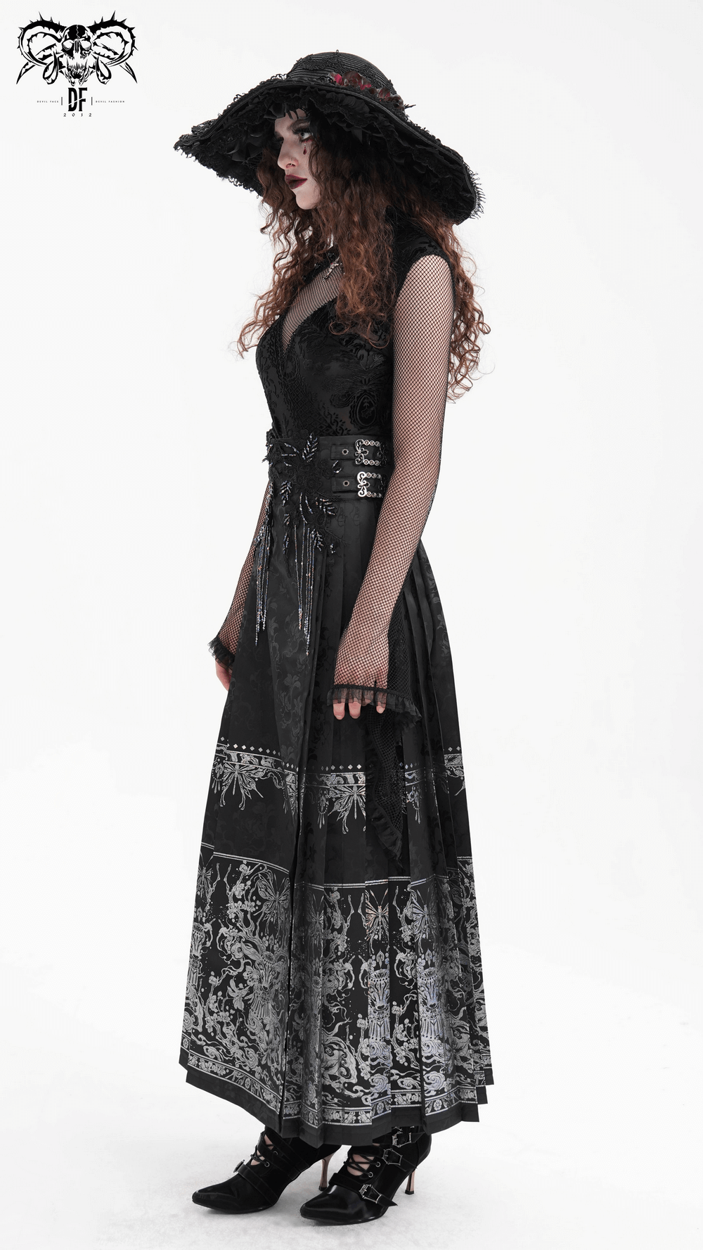 Gothic black skirt with embroidered details, featuring a flowing silhouette and embellished waist, paired with a stylish wide-brim hat.