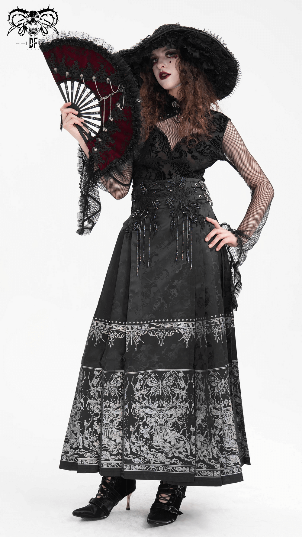 Gothic black skirt with embroidered details and embellished waist, paired with a dramatic hat and fan for a captivating look.