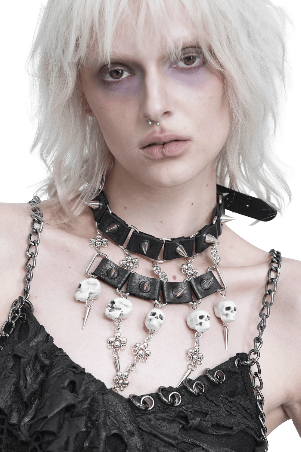 Gothic Skull Black Choker with Spikes and Chains worn by model, featuring skull beads and silver-tone spikes.