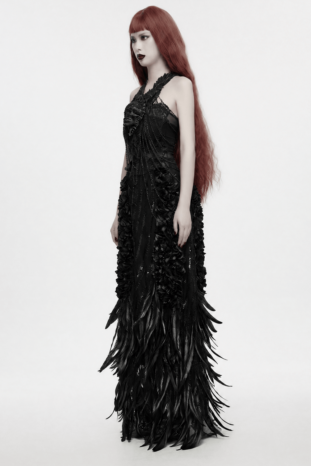 Gothic Skull Chain Body Harness with Lace Details worn by model in dramatic black gown with floral and feather accents.