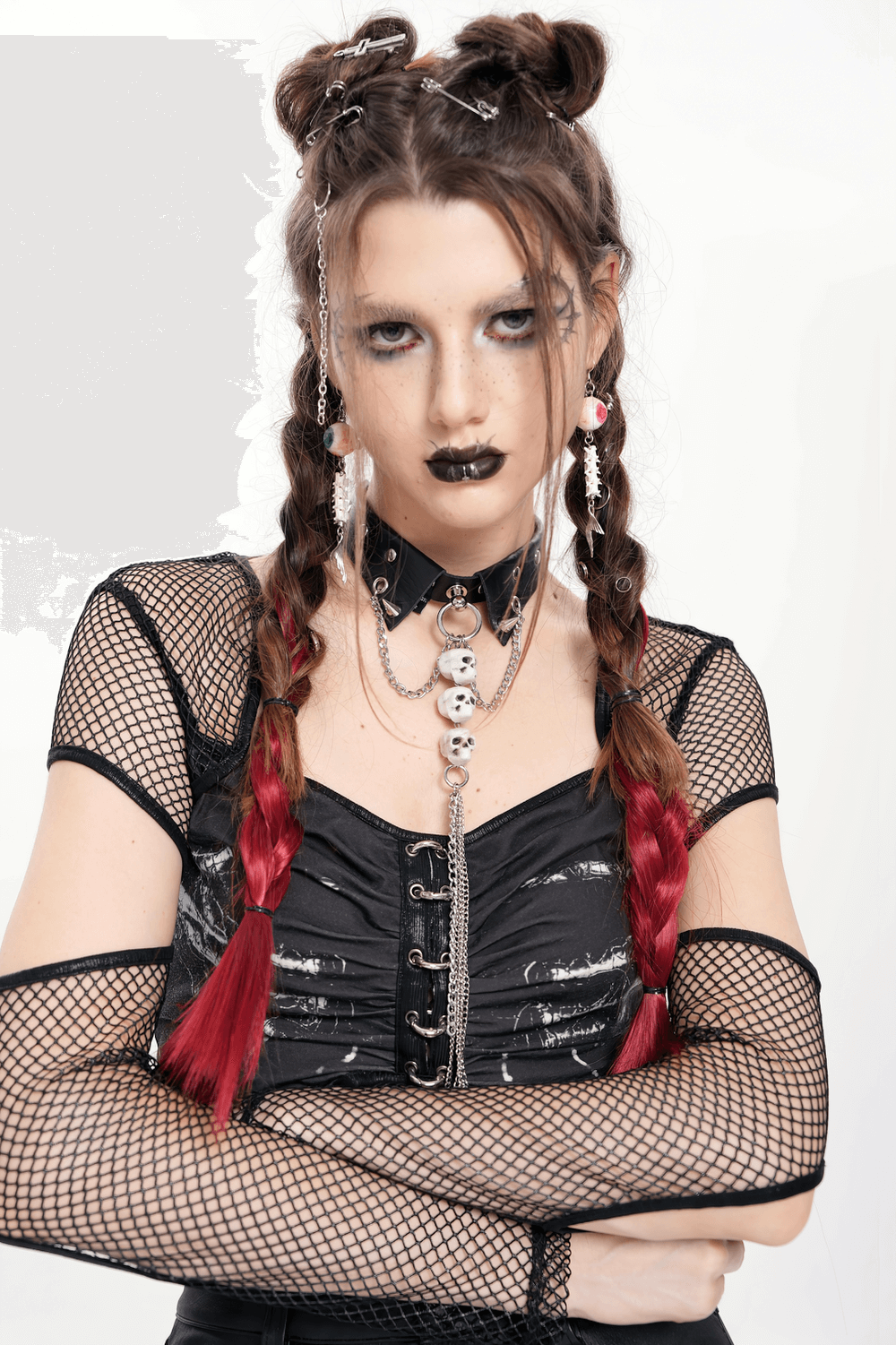 Gothic style model wearing a punk rock faux leather skull choker with braided hair and edgy makeup.