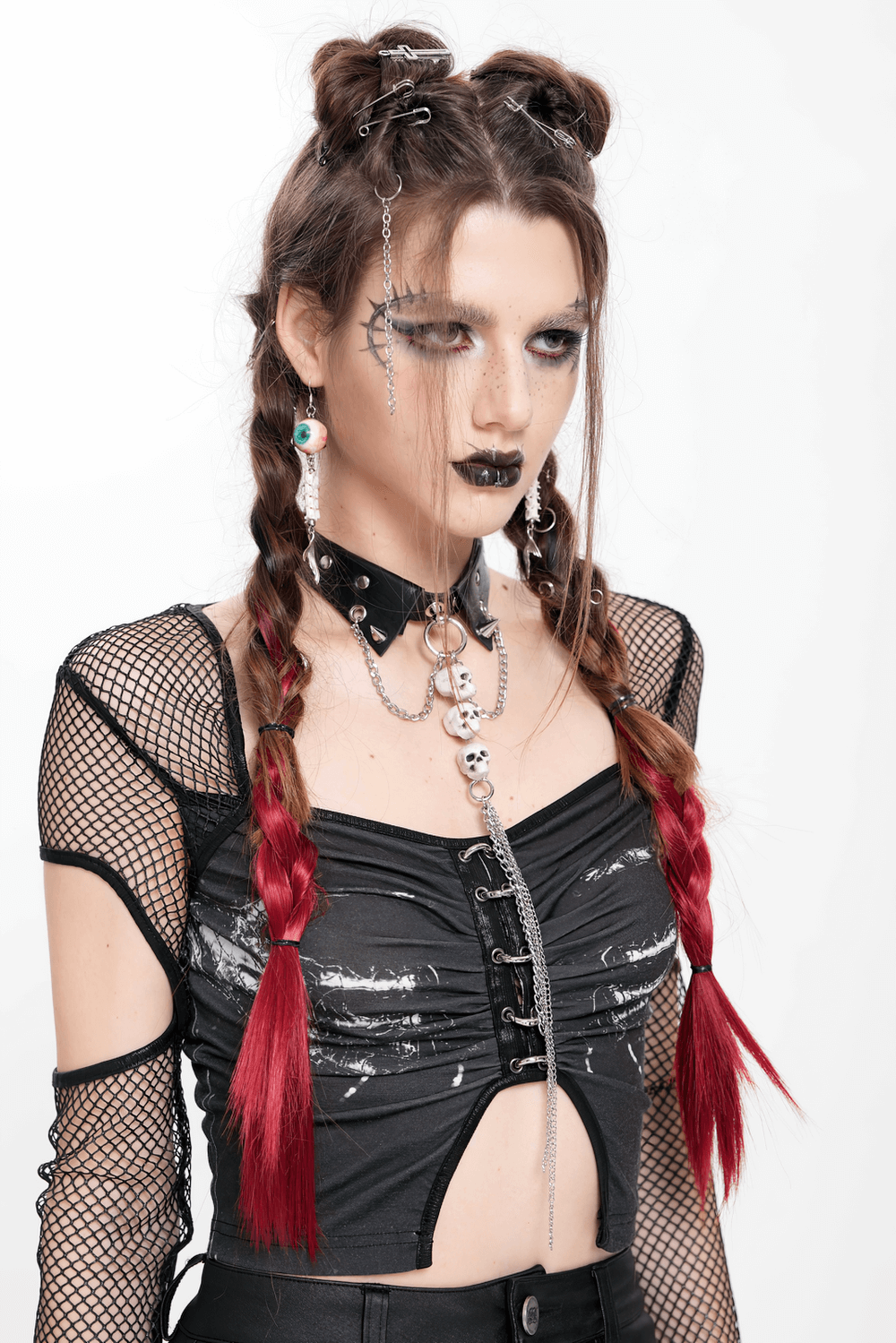 Gothic style model with braided red hair, wearing a punk rock outfit and a skull choker necklace for an edgy look.