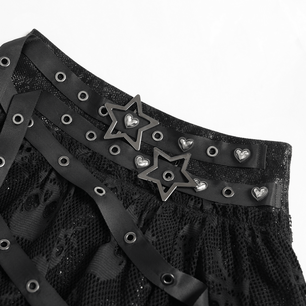 Close-up of Gothic Skull Lace Mini Skirt with Strap Details featuring star and heart buckles.
