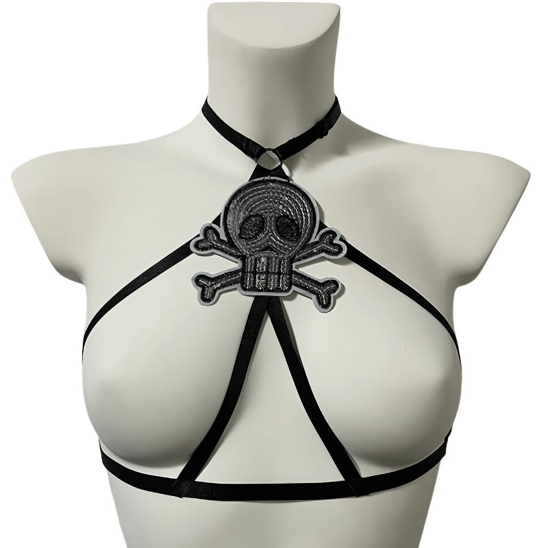 Gothic skull patch open chest harness bra with adjustable bondage straps for edgy women's fashion.