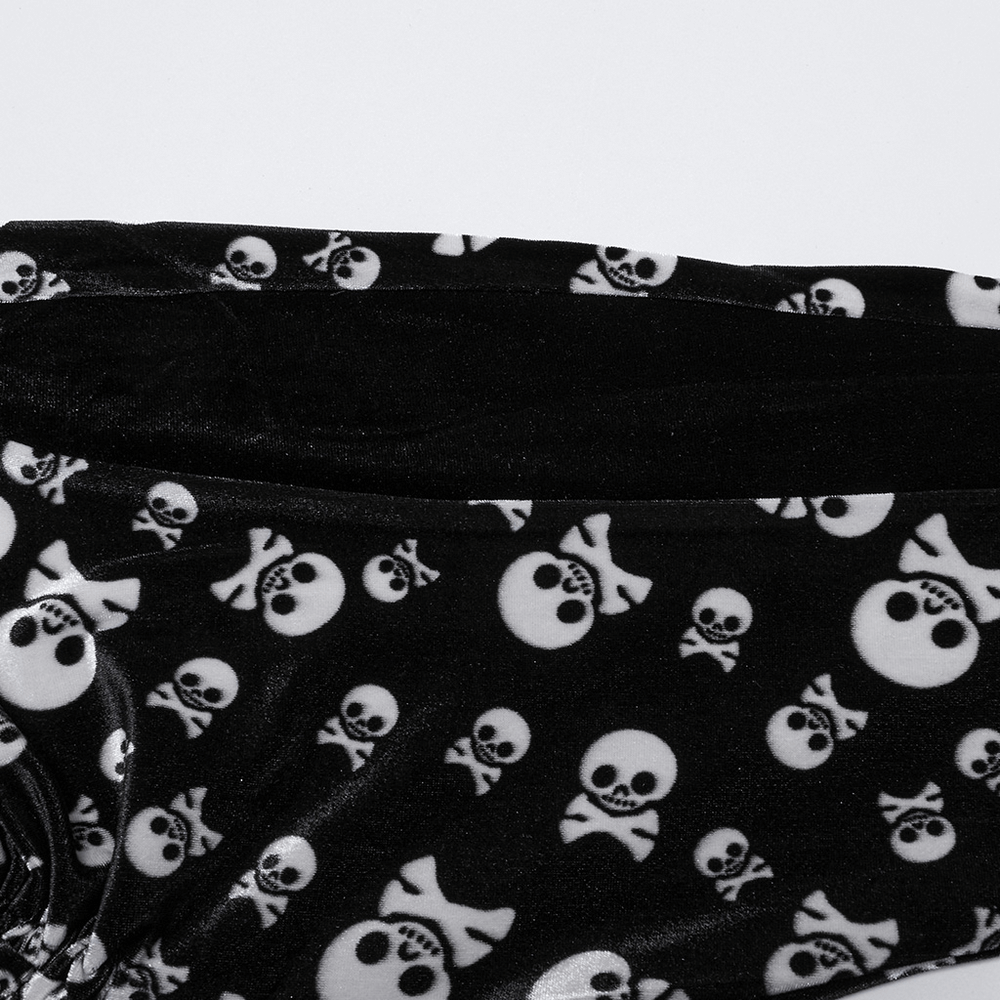 Gothic skull print flared pants featuring a soft velvet panel and bold skull design, perfect for alternative fashion.