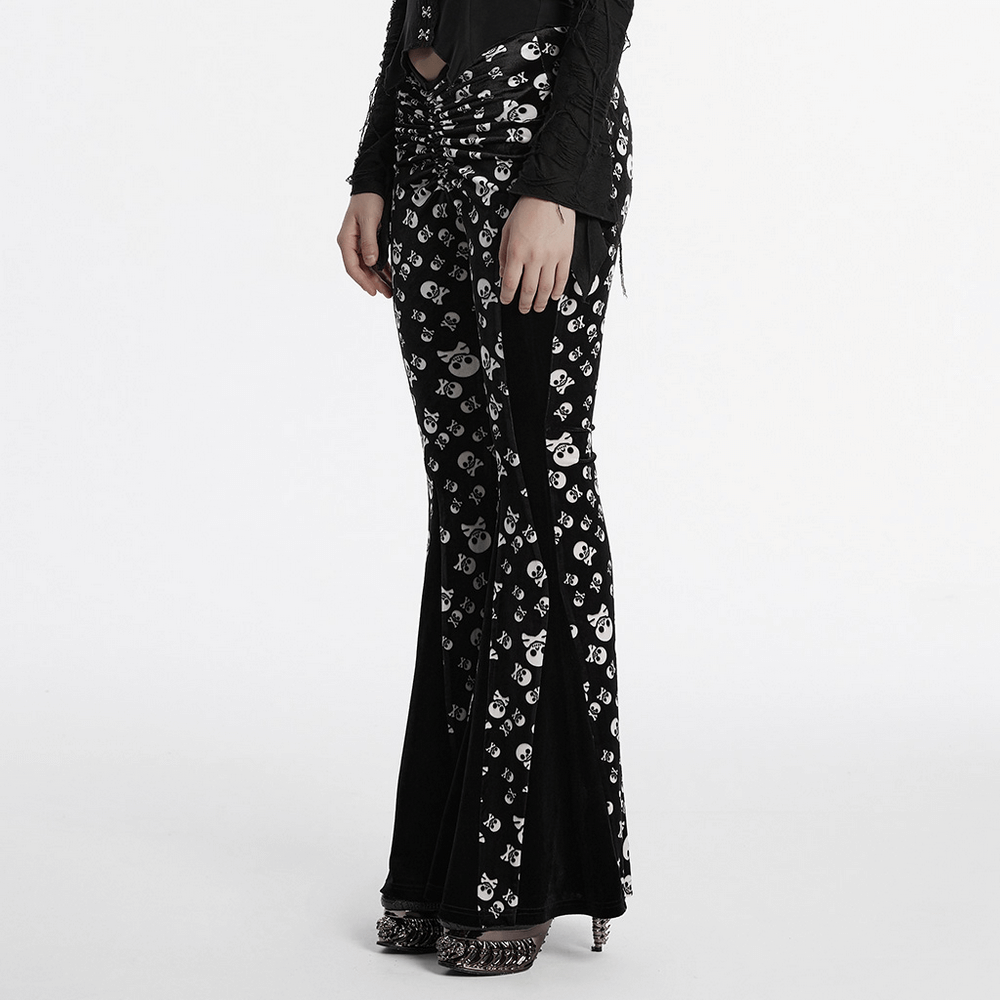 Gothic skull print flared pants with velvet panel design, showcasing a slim fit and sultry ruched front detail.