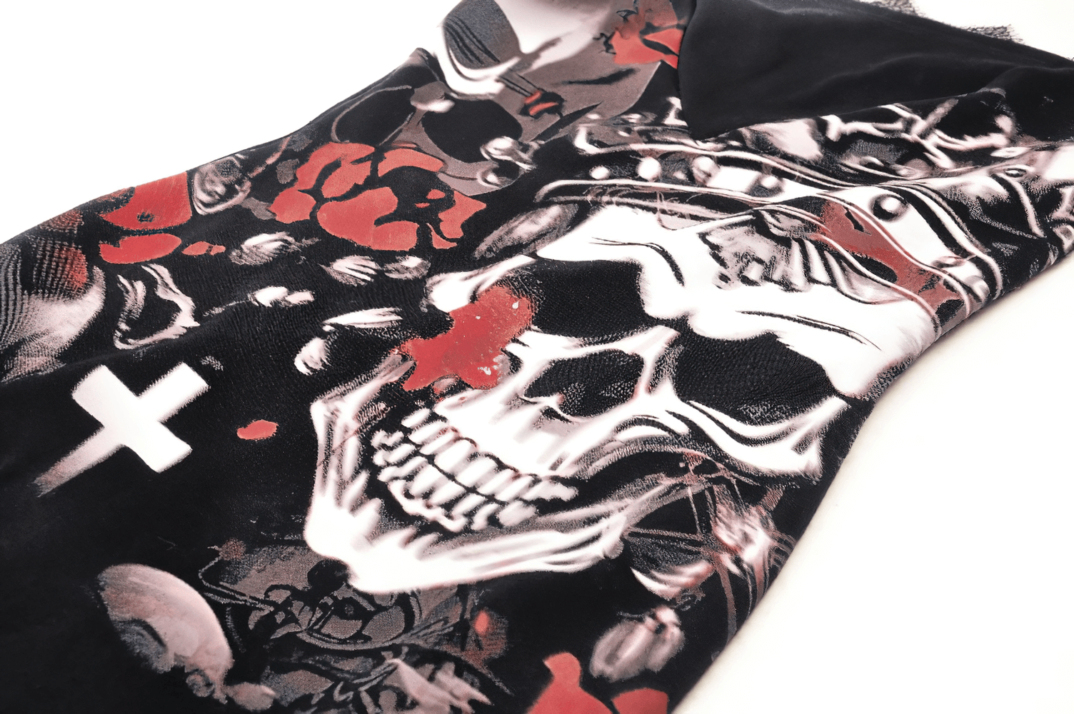 Gothic skull and rose print detail on sleeveless mini dress, showcasing intricate lace elements and bold design.