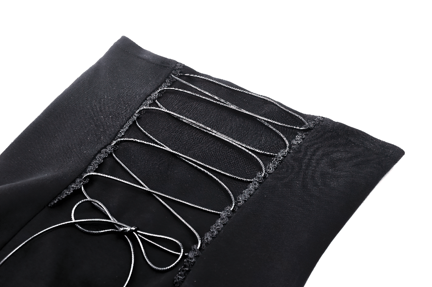 Close-up of black lace-up detail on a gothic dress, showcasing intricate design elements and stylish knot.