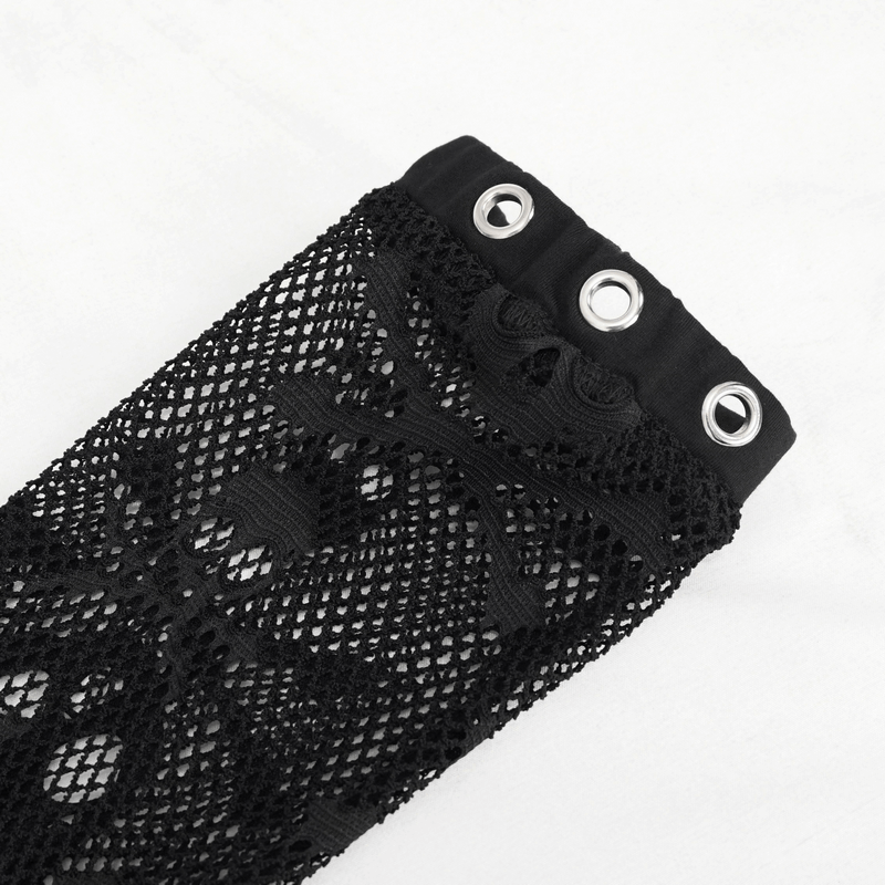 Close-up of black mesh fabric with skull design and eyelets, perfect for gothic fashion accessories.