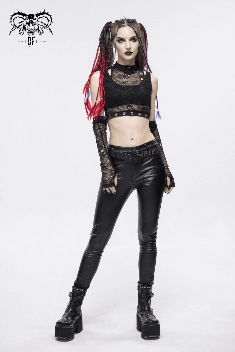 Fashionable model in a gothic skull printed mesh crop top and detachable sleeves, styled with edgy accessories.