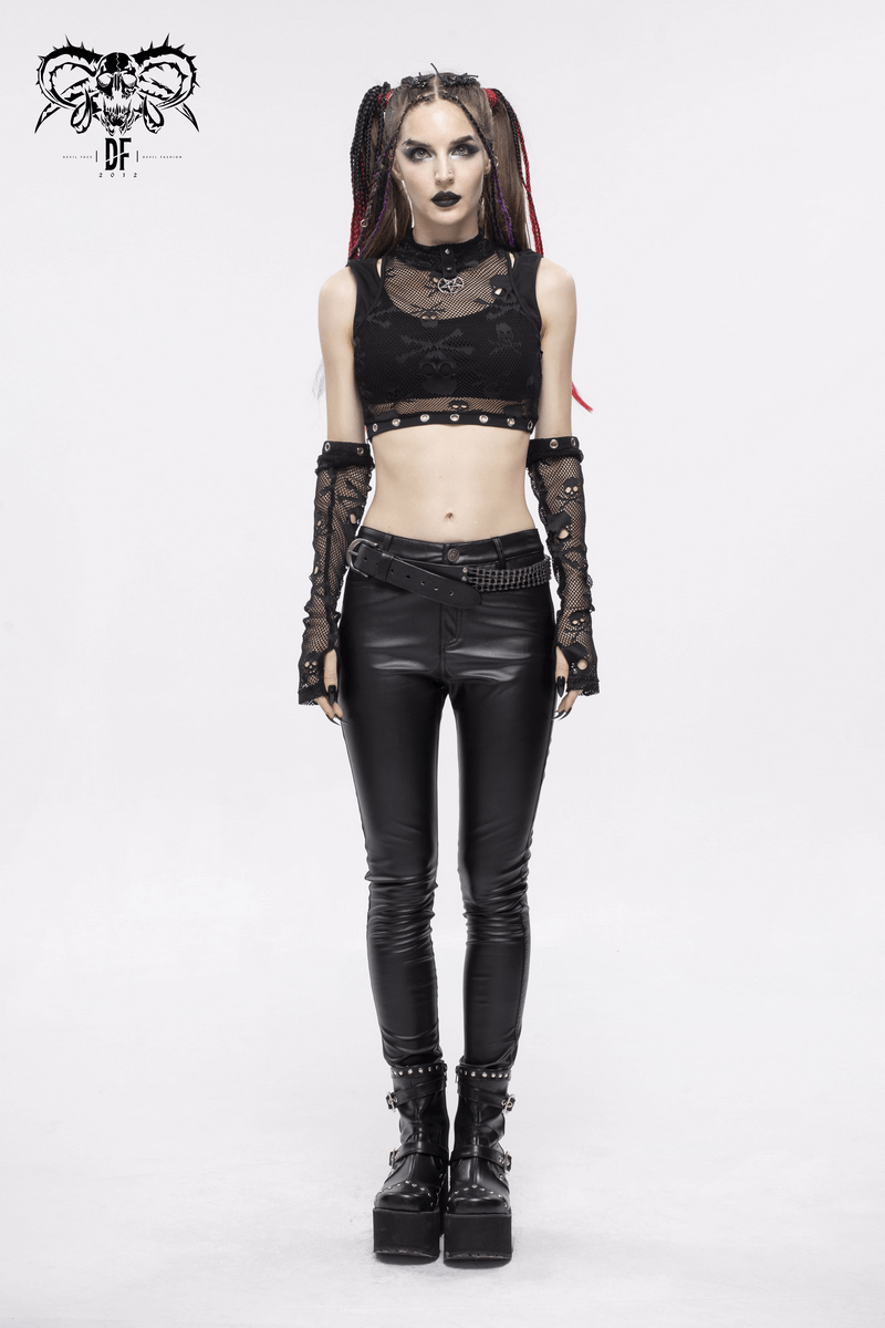 Gothic model wearing a black mesh crop top with skull print and detachable sleeves, paired with edgy black pants.