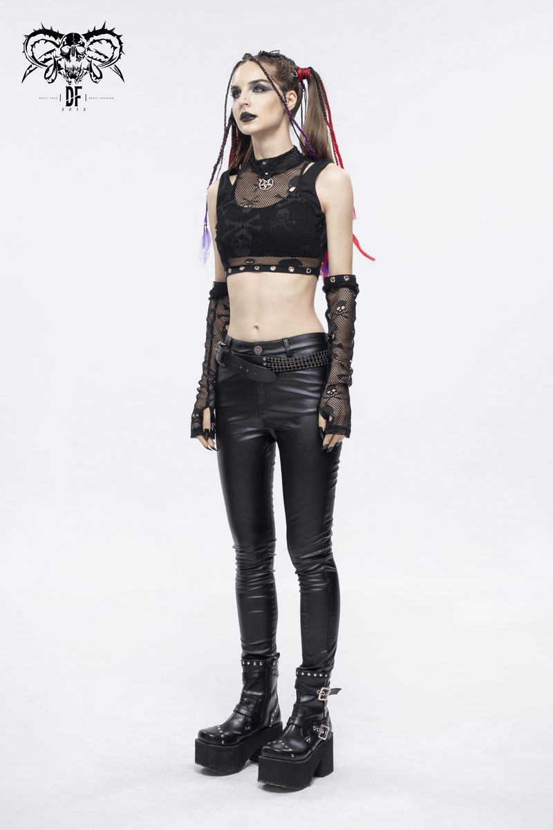 Model showcasing gothic skull printed black crop top with detachable sleeves and leather pants, embodying alternative fashion.
