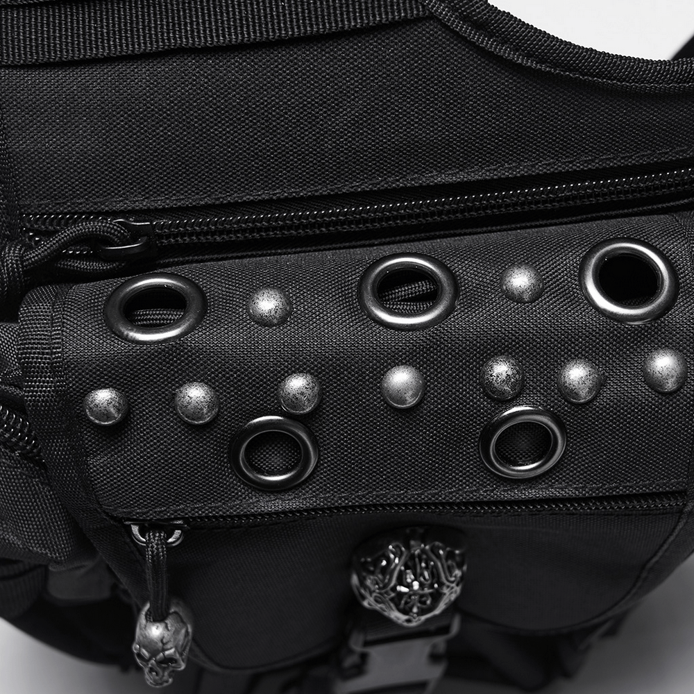 Close-up of gothic skull waist-leg bag with rivet detailing and metal accents, showcasing punk style.