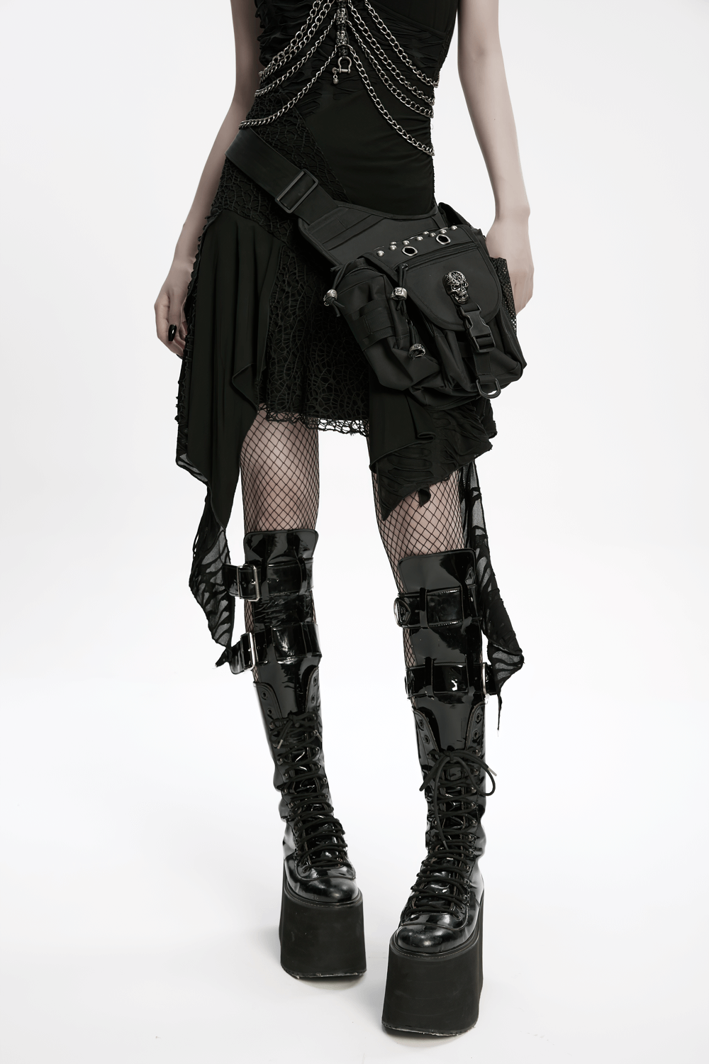 Gothic skull waist-leg bag with rivets worn with punk outfit and platform boots, showcasing edgy fashion style.