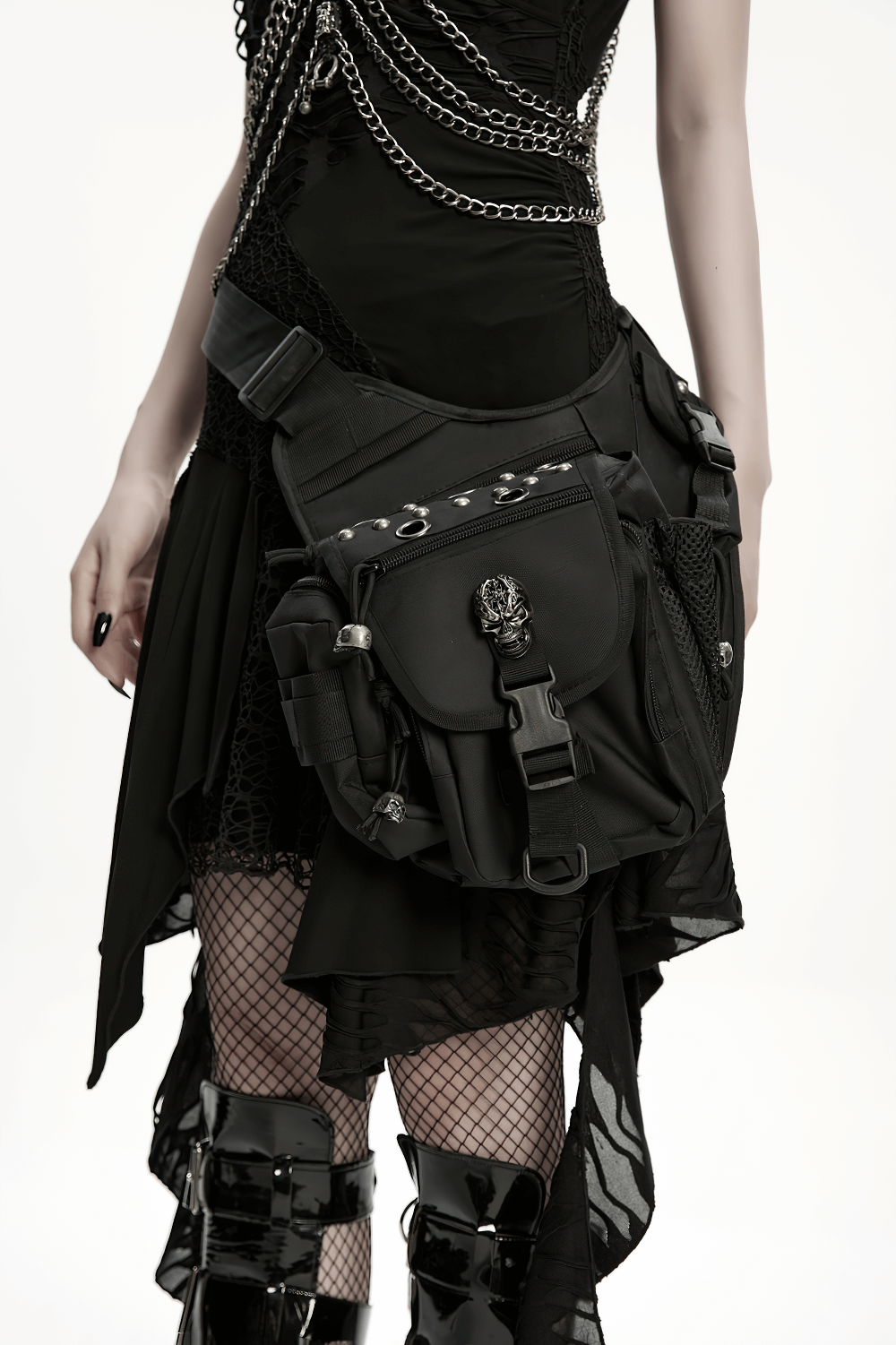 Gothic skull waist-leg bag with rivets, worn stylishly over a black outfit, perfect for punk and alternative fashion.
