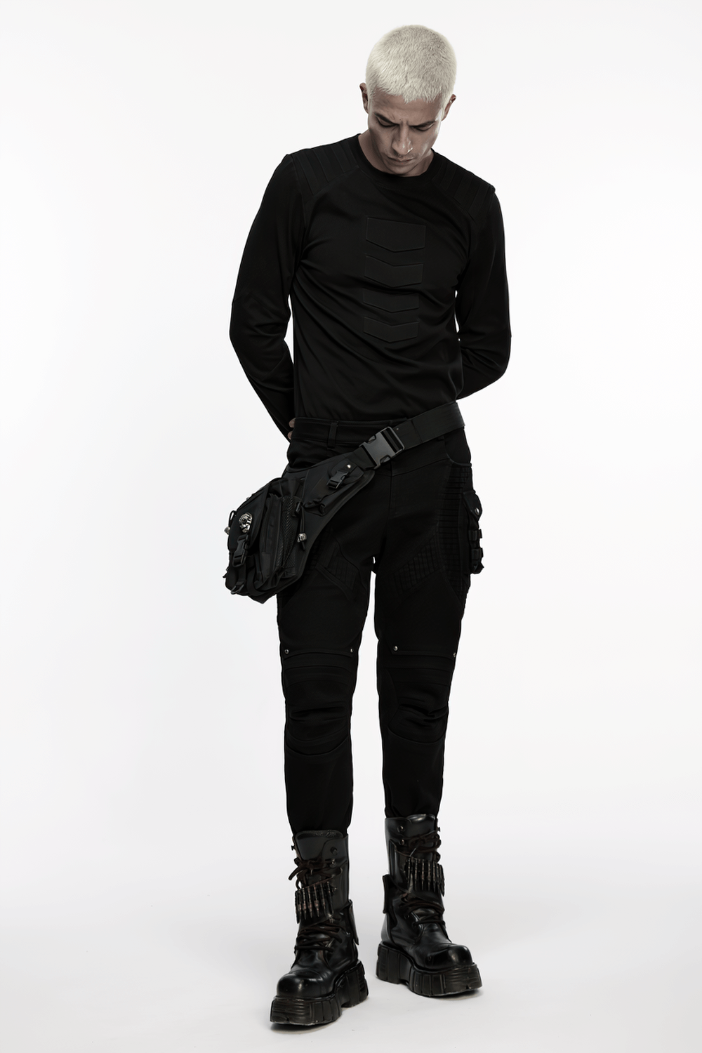 Model showcasing gothic skull waist-leg bag with rivet detailing, styled in punk techwear outfit.