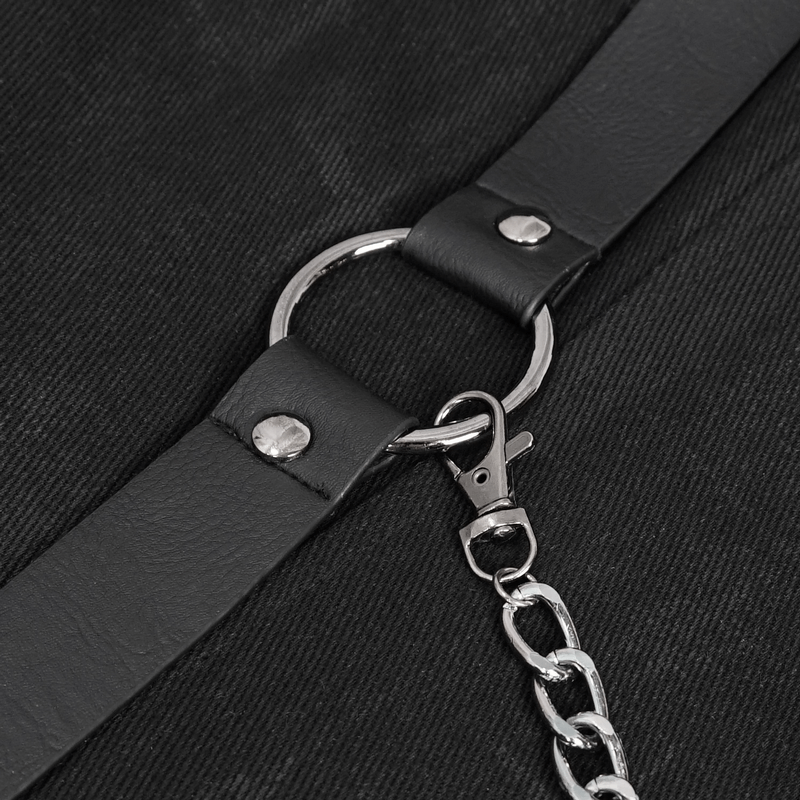 Close-up of gothic coat harness detailing with silver chain and black leather strap.