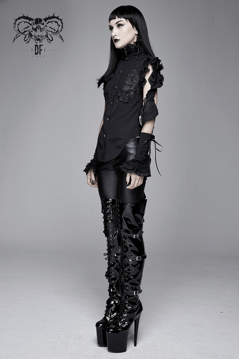 Gothic sleeveless black blouse with floral embroidery and wavy ruffles, paired with shiny thigh-high boots.