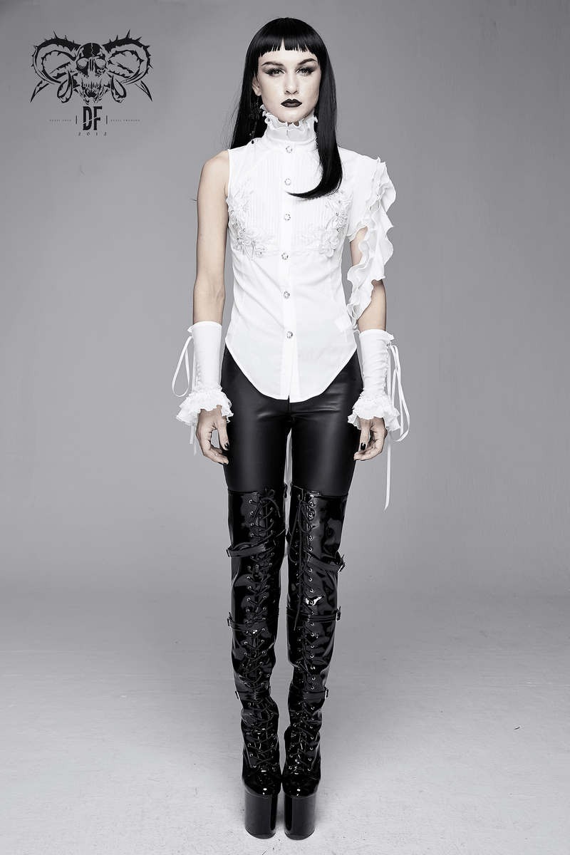 Gothic sleeveless white blouse with wavy ruffles, paired with black leather pants for a striking look.