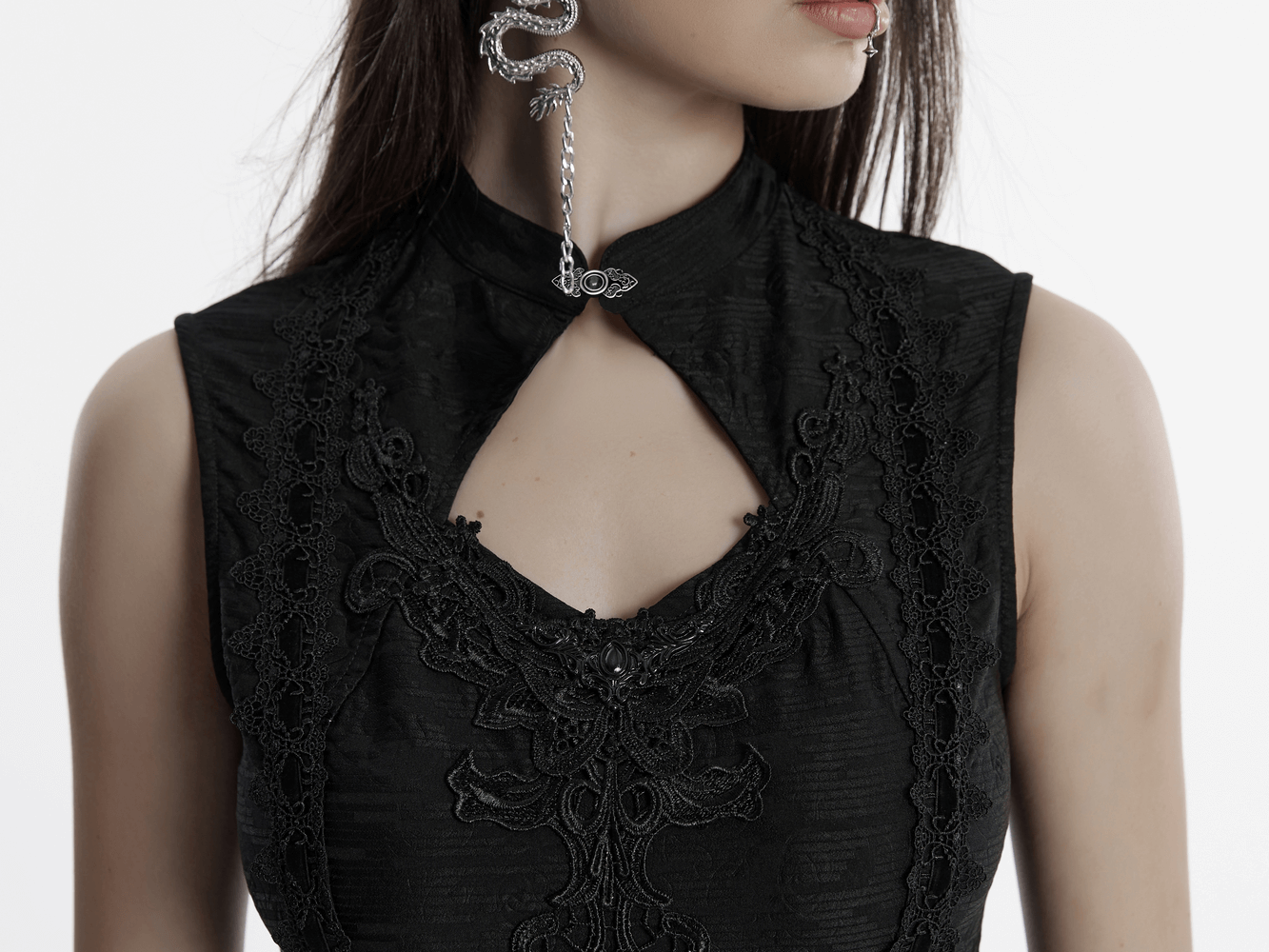 Close-up of gothic sleeveless cheongsam dress showcasing hollow cutout and lace details, exuding dark elegance.