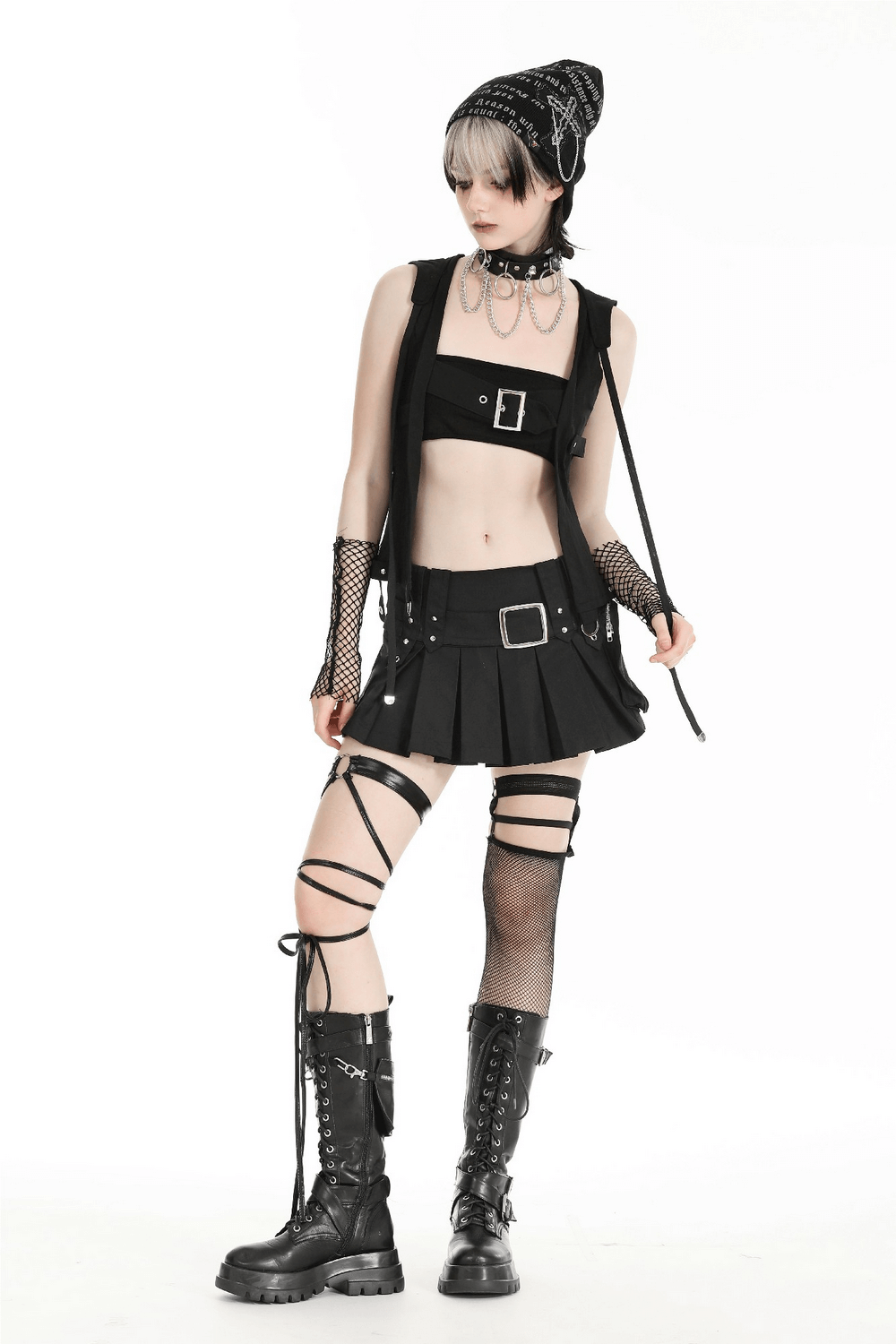 Gothic sleeveless hooded top styled with a black skirt, fishnet gloves, and combat boots for a punk rock look.