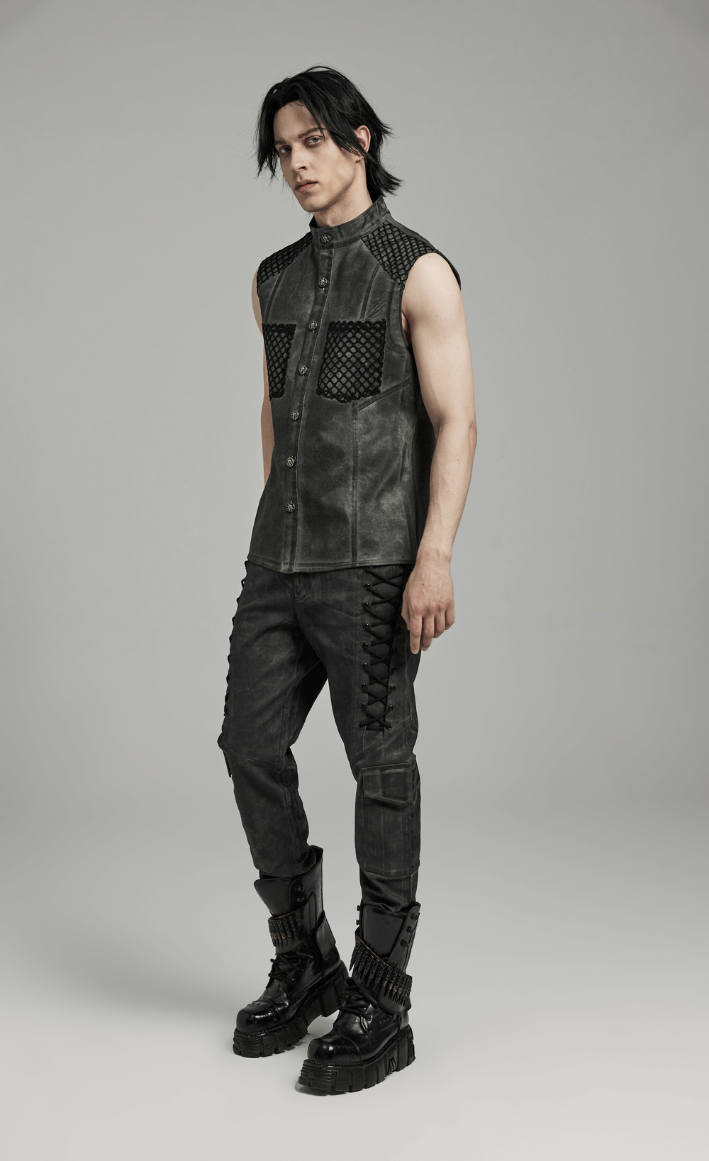 Gothic sleeveless shirt with mesh detailing, pockets, and button closure for a stylish edgy look.