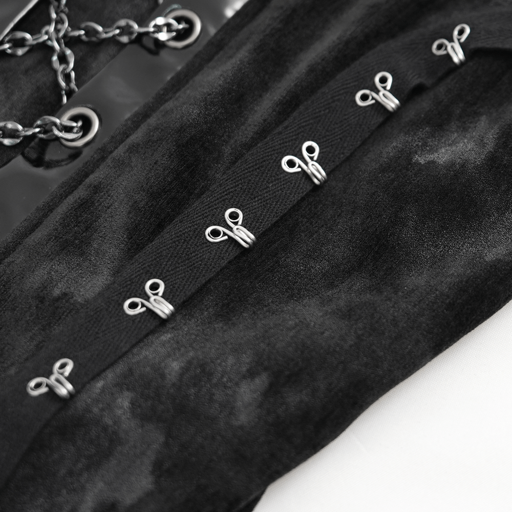 Close-up of black velvet fabric with silver chain and lace-up details on a gothic slip dress. Perfect for an edgy look!