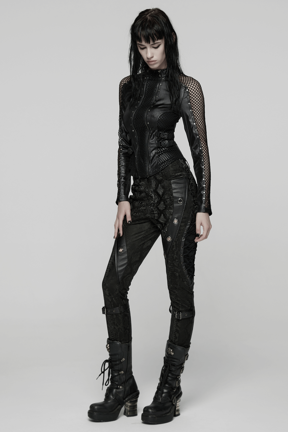 Gothic Snake Print Pants with Eyelet and Strap Detail showcased in a punk-inspired outfit with black accents.