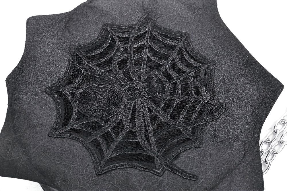 Gothic spider web shoulder bag with silver chain straps and embroidered web design.