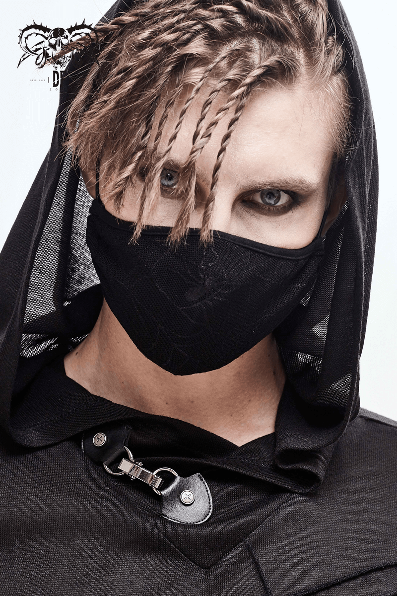 Stylish unisex model wearing a black gothic spiderweb face mask, showcasing adjustable straps and a hooded outfit.