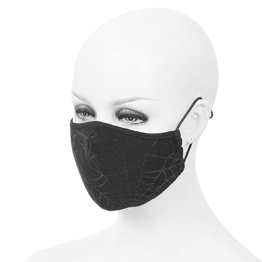 Gothic spiderweb face mask on mannequin, stylish unisex black breathable mask with adjustable straps.