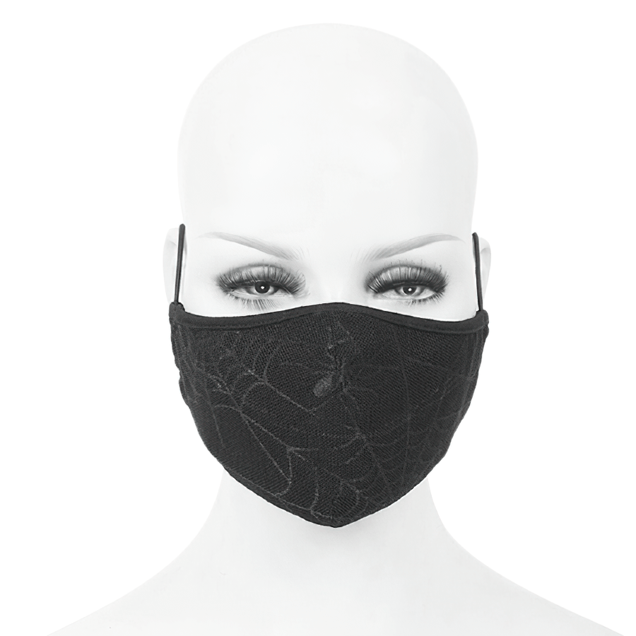 Gothic black spiderweb face mask on a mannequin, breathable with adjustable straps, stylish unisex accessory.