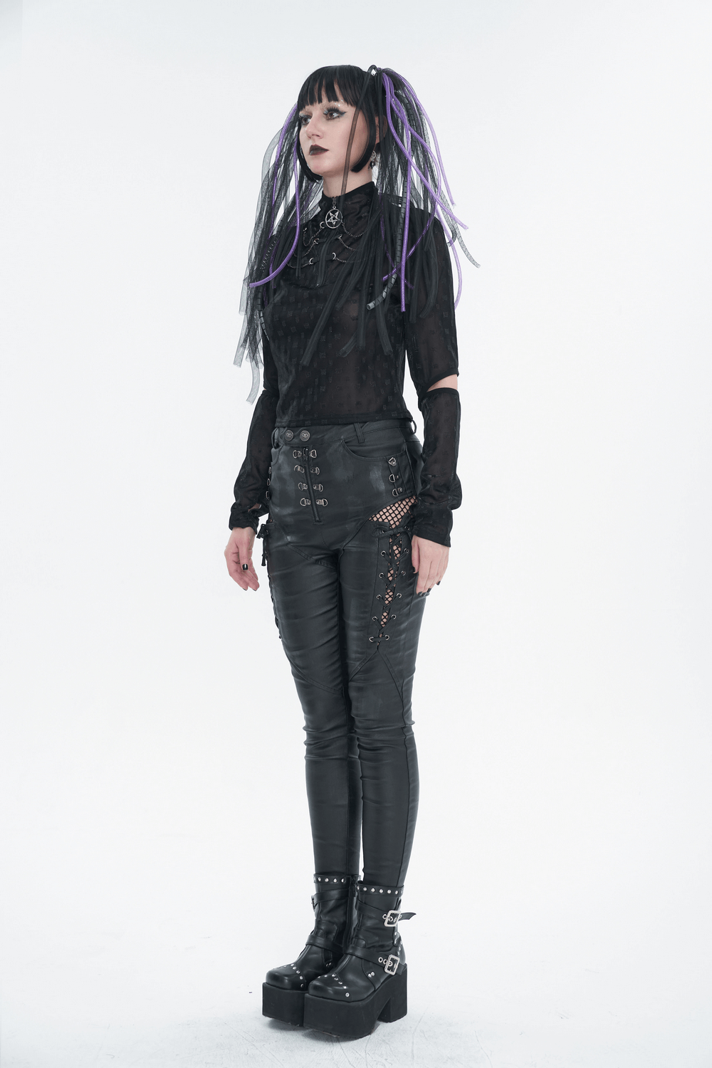 Stylish woman in gothic black top with pentagram zipper and edgy outfit featuring purple highlights and platform boots.