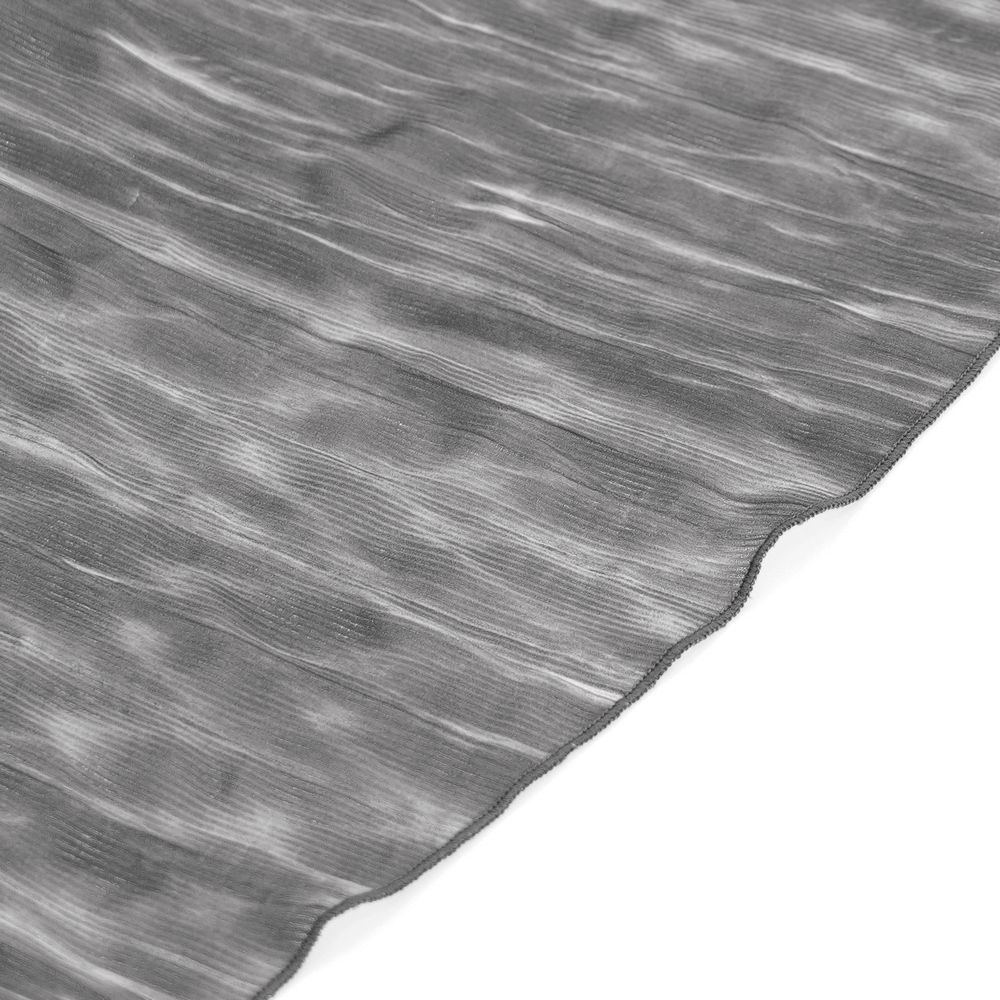 Close-up of a textured gray pleated fabric showcasing a flowing design for a gothic steampunk skirt.