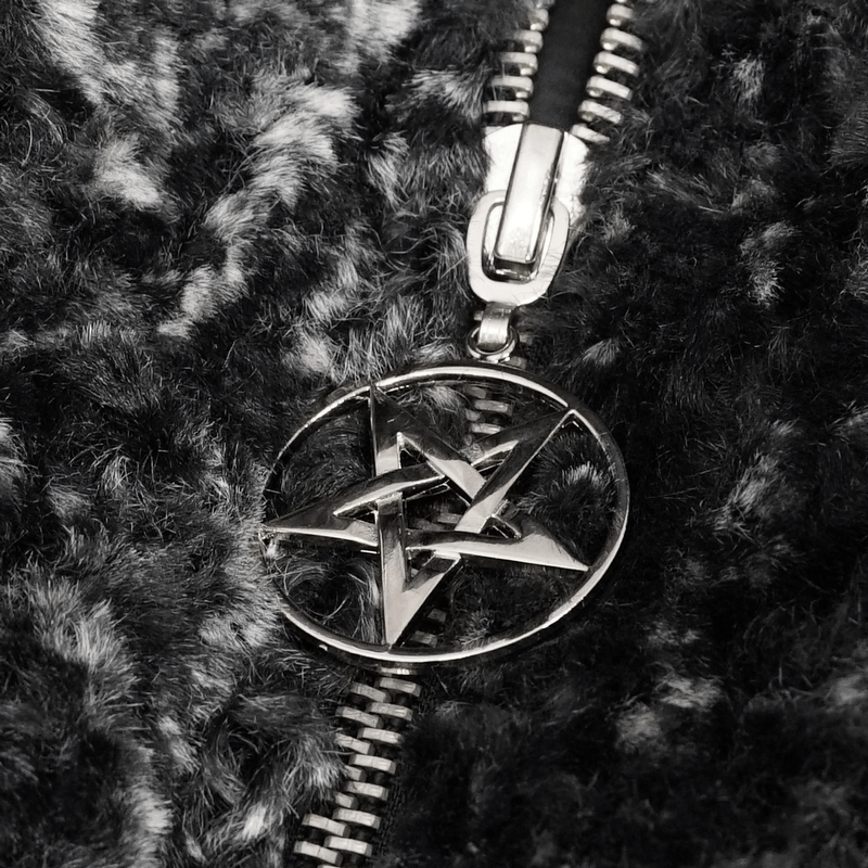 Close-up of a gothic-style zipper with a silver pentagram accent on a warm black jacket.