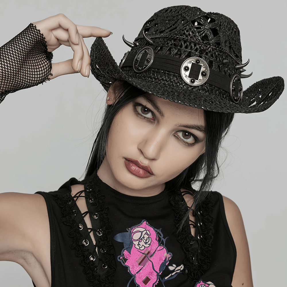Stylish Gothic straw cowboy hat with spikes and tassel, worn by a model showcasing punk fashion.